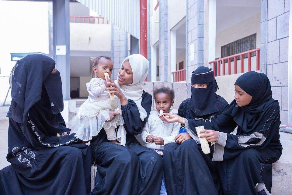 Yousra, 16, and friends take a break from their catch-up classes in Taizz, Yemen.